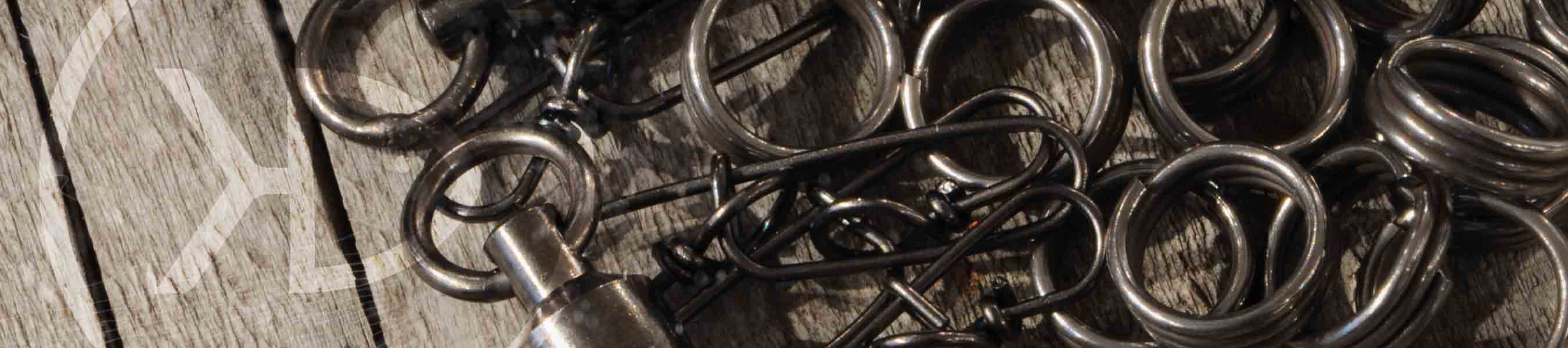 Pike & Musky Staylock snaps, swivels and splitrings lying on an old wood table