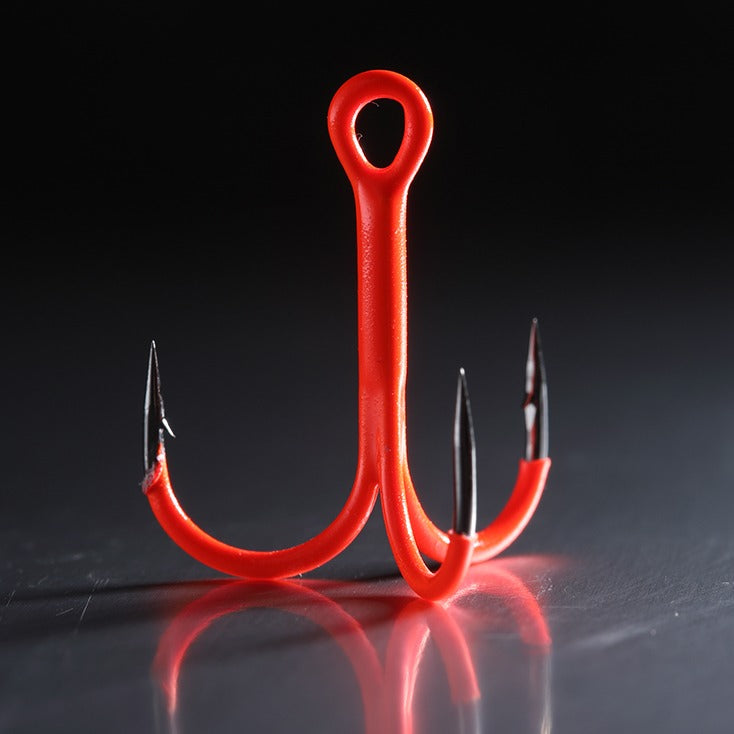 BKK Spear UVO 3/0 treble hooks for pike & musky lures sitting on a table