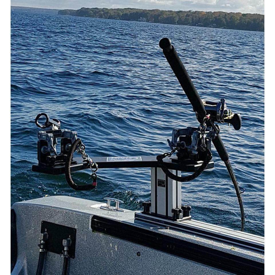 2 Musky trolling setup on a boat gunnel, securely attached to the boat with brotherhood trolling rod leashes